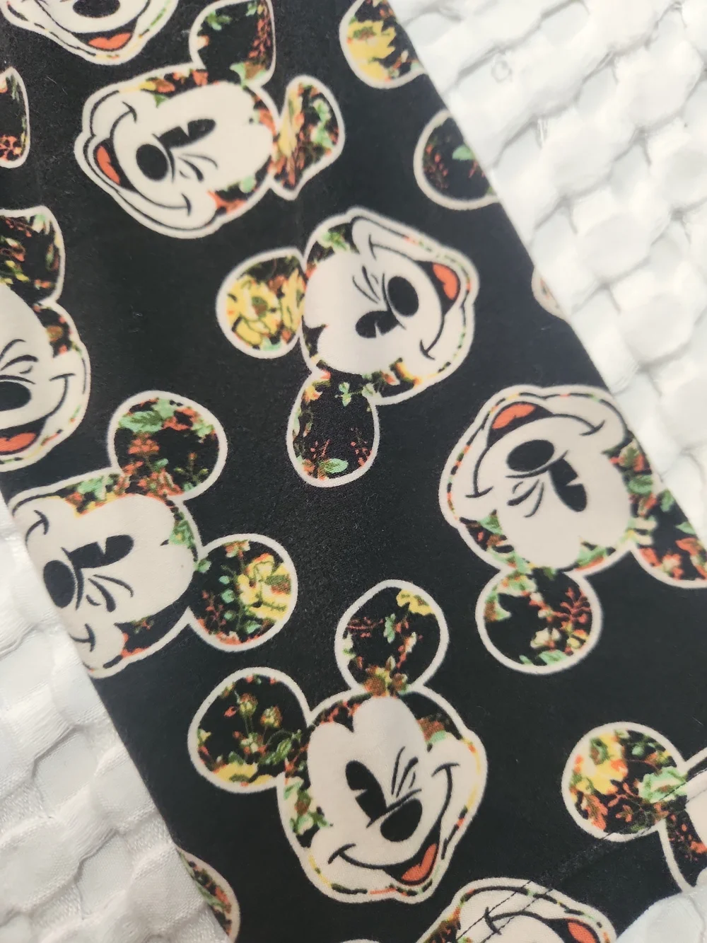 LuLaRoe Black Skinny Jeans with Cream Character Faces